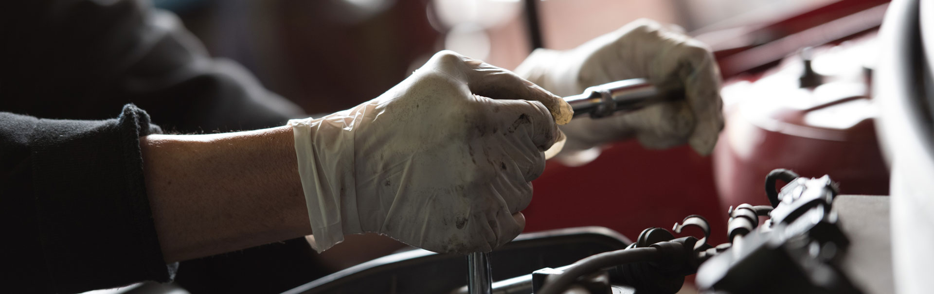 staff performing mechanical repairs